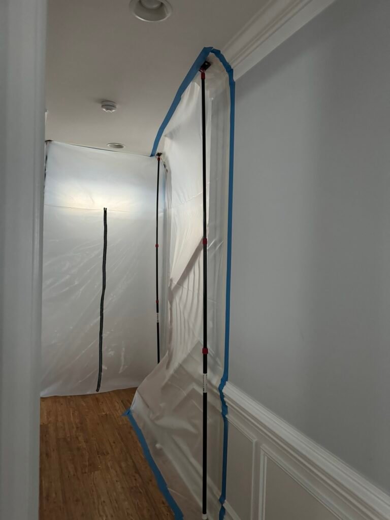 Plastic containment barrier installed during mold remediation to isolate contaminated areas inside a home in Charlotte NC